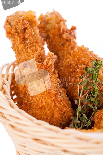 Image of Crisp crunchy golden chicken legs and wings