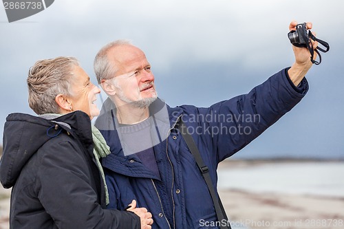 Image of Elderly couple taking a self portrait