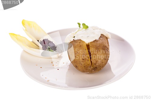 Image of Baked jacket potato with sour cream sauce