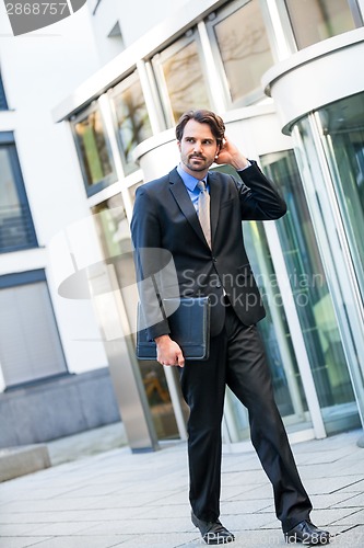 Image of Businessman standing waiting for someone