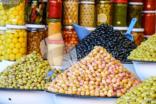 Image of Olives and pickles on display at a farmers market