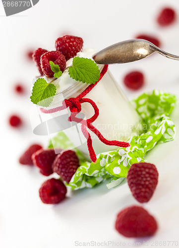 Image of Raspberries and yoghurt or clotted cream