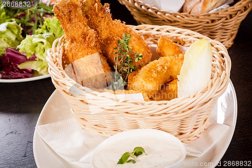 Image of Crisp crunchy golden chicken legs and wings