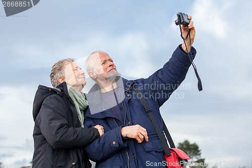 Image of Elderly couple taking a self portrait