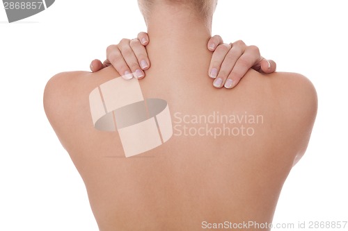 Image of Woman caressing her bare shoulder and back