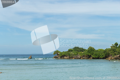 Image of Beautiful tropical beach with lush vegetation