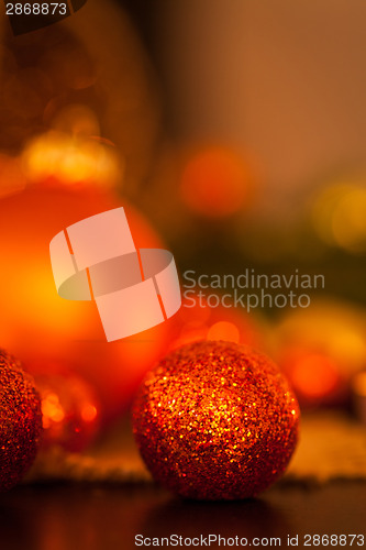 Image of Warm gold and red Christmas candlelight background