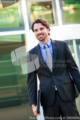 Image of Businessman standing waiting for someone