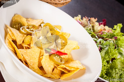 Image of Nachos with cheese sauce and chilli pepperoni