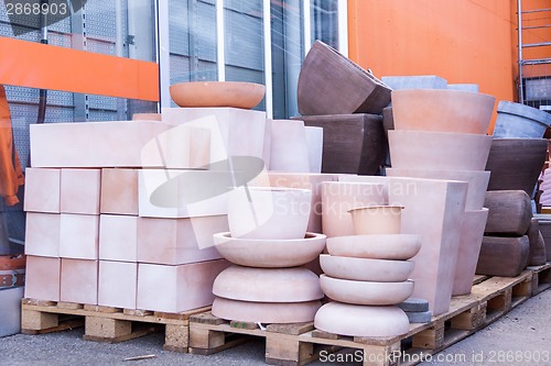 Image of Glazed and unglazed ceramic flower pots