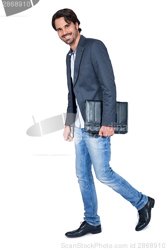 Image of Handsome stylish man carrying a briefcase