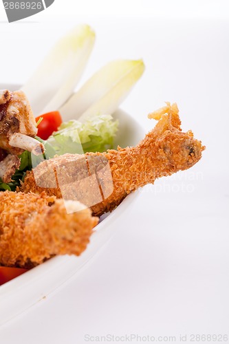 Image of Platter of mixed meats, salad and French fries