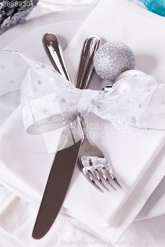 Image of Stylish blue and silver Christmas table setting