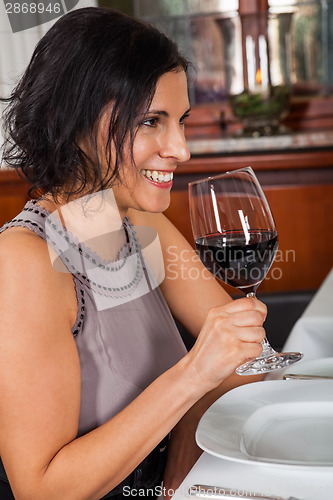 Image of Waiter happily accommodating couple