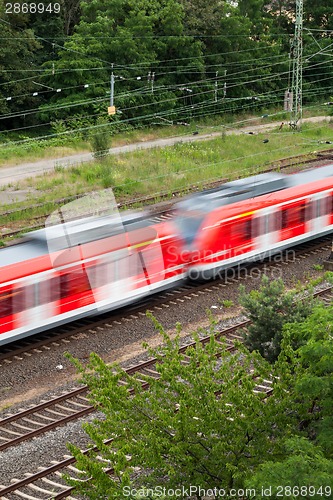 Image of Fast moving train with red stripe