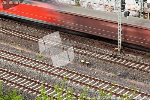 Image of Fast moving train with red stripe