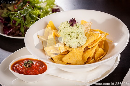 Image of Crisp corn nachos with guacamole sauce