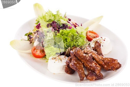 Image of grilled beef stripes fresh salad and goat cheese