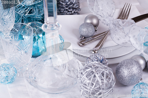 Image of Stylish blue and silver Christmas table setting