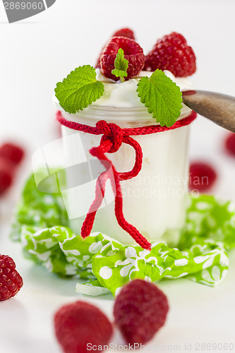 Image of Raspberries and yoghurt or clotted cream