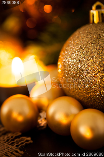 Image of Warm gold and red Christmas candlelight background