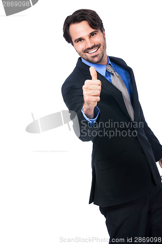 Image of Enthusiastic businessman giving a thumbs up