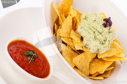 Image of Crisp corn nachos with guacamole sauce