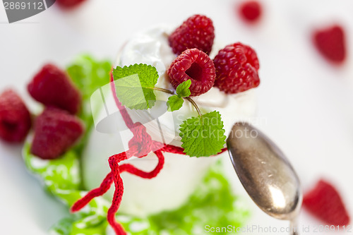 Image of Raspberries and yoghurt or clotted cream