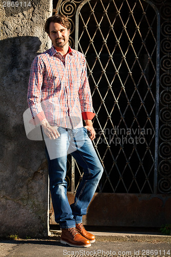 Image of Male model leaning against wall