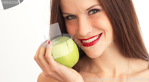 Image of Green Granny Smith Apple Held Close to Attractive Woman Face