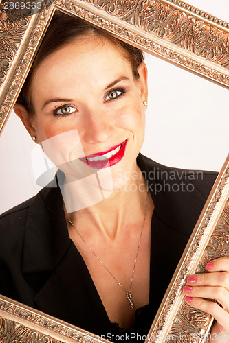 Image of Beautiful Vibrant Attractive Woman Framed by Ornate Picture Fram