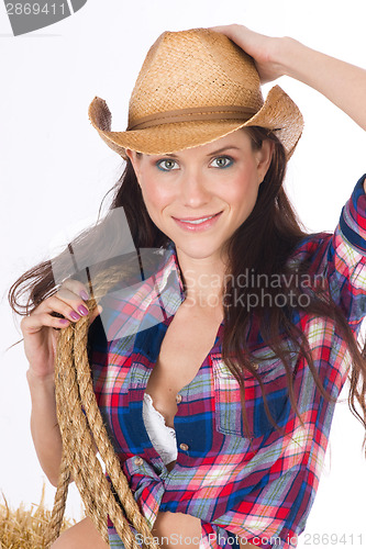 Image of Country Woman Holds Her Cowboy Hat and Rope