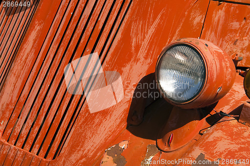 Image of Old Orange Vinatge Fire Truck Sits Rusting in Desert Country