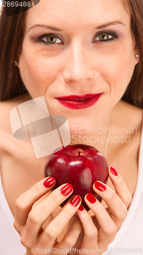 Image of Manicured Female Hands Holding Red Delicious Apple