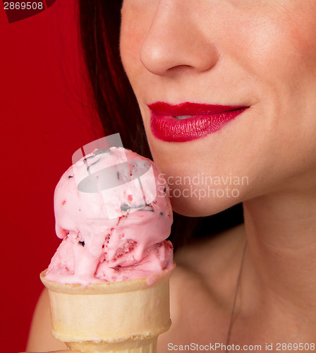 Image of Female Lips Eating Strawberry Ice Cream Cone Red Lipstick