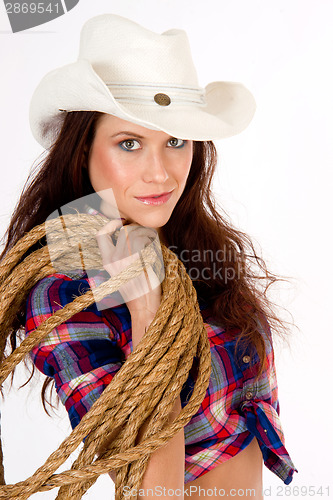 Image of Beautiful Cowgirl Smiles in White Cowboy Hat Holding Rope