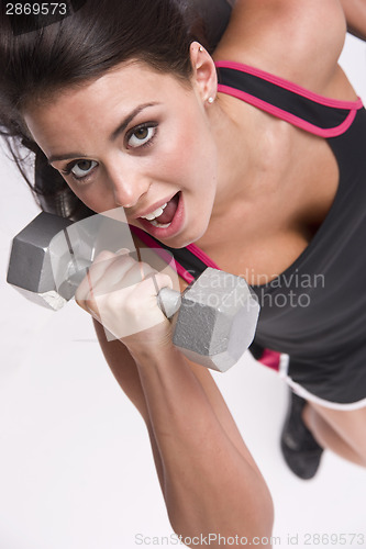 Image of Lady Lifting Vertical Barbells in Gym Laying Down