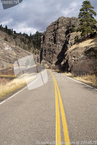 Image of Tow Lane Highway Travels Rugged Territory Western United States