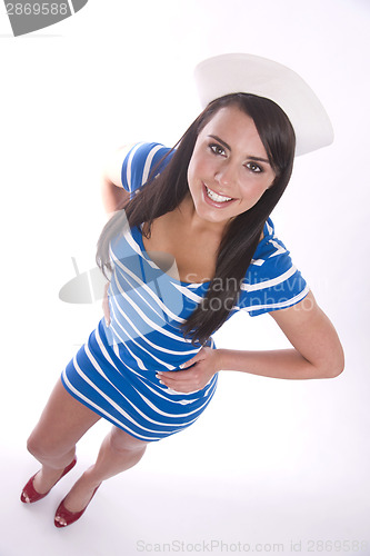 Image of Pretty Brunette Woman Smiles Sporting Her Sailor's Cap