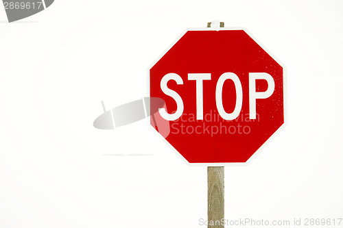 Image of Stop Sign in Snow Snorm Rural Road