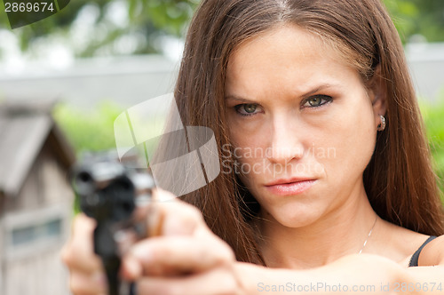 Image of Handgun Range Shooting Practice by Angry Looking Female