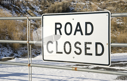 Image of Road Closed Sign Rural Setting in Fresh Snow