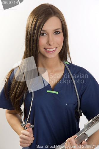 Image of Vibrant Female Nurse With Stethoscope and Chart Making Rounds