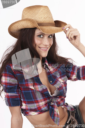 Image of Hat Tip From Attractive Cowgirl on Haybale