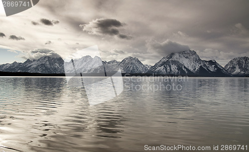 Image of Lake Reflection Cloud Cover Jagged Peaks Grand Teton Wyoming 