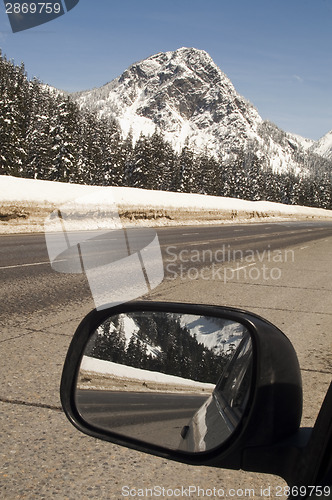 Image of Driver Checks Rear View Mirror Motoring North Cascades Washingto