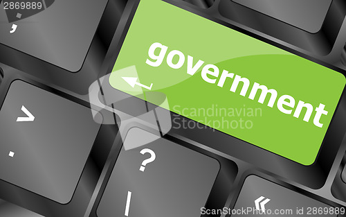 Image of government word on keyboard key, notebook computer button