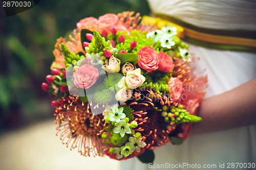 Image of Bride with bouquet, closeup