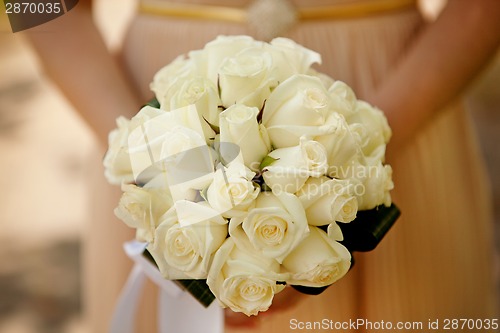 Image of Bride holding wedding flower bouquet
