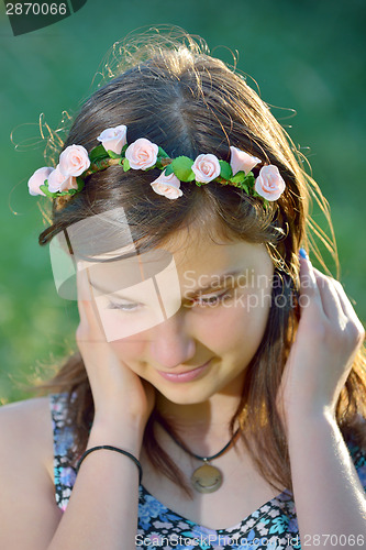 Image of beautiful girl with wreath of flowers
